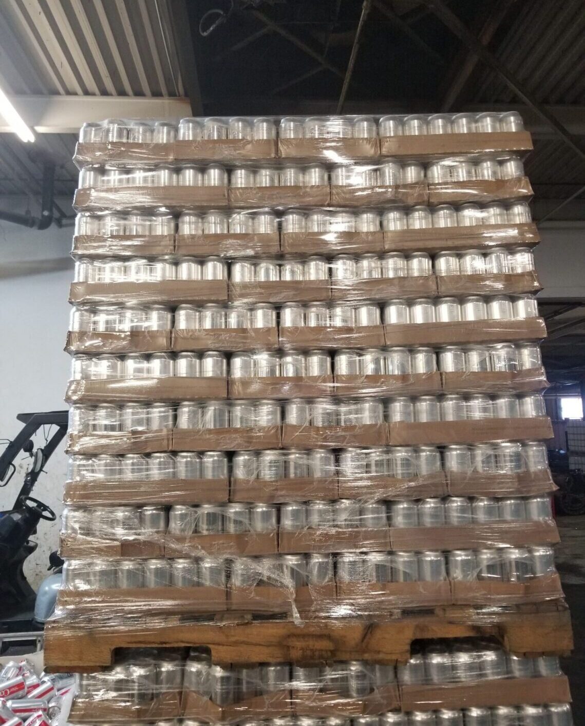 Aluminum cans stacked on pallets for destruction