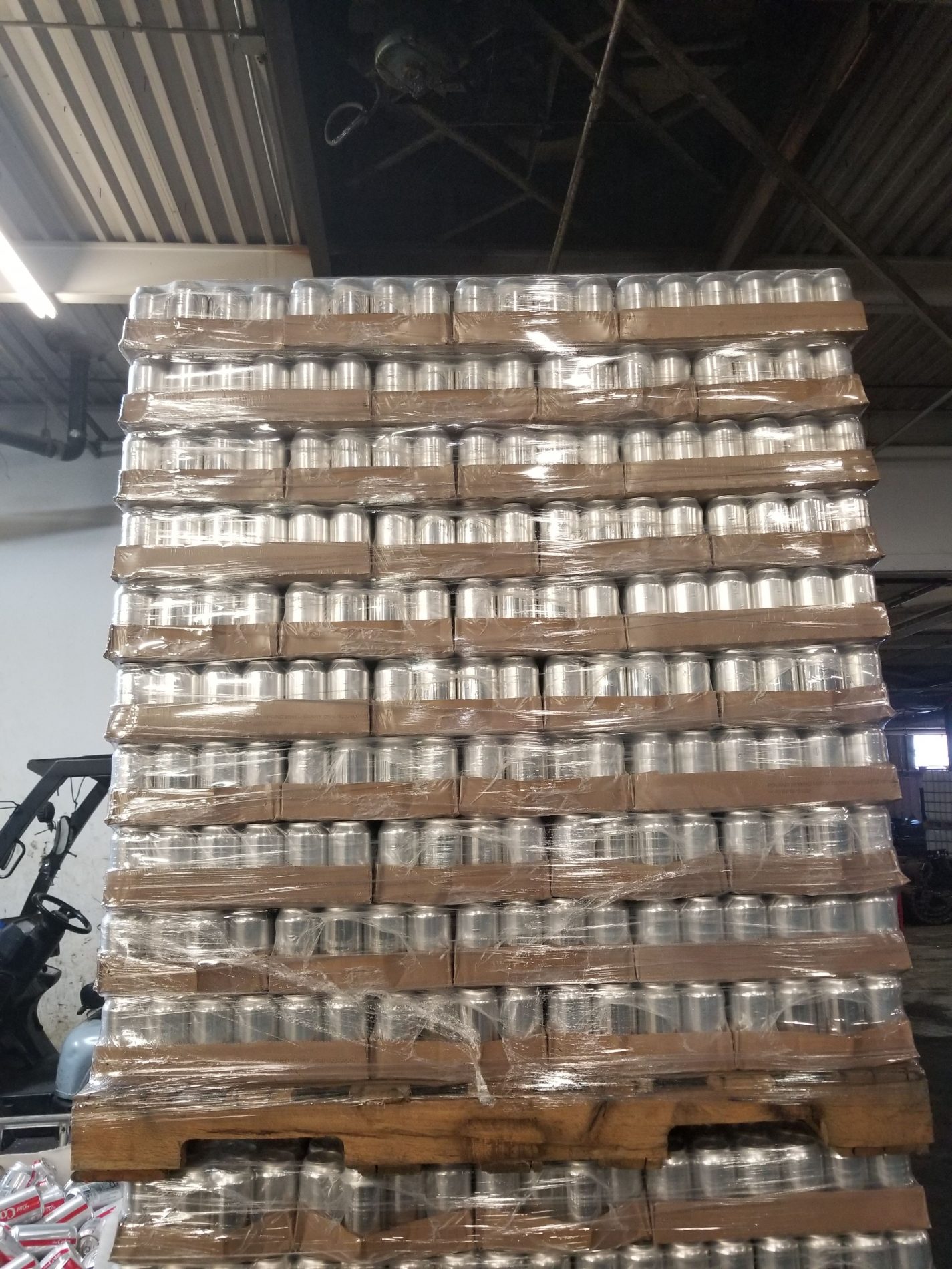 aluminum cans stacked on pallets
